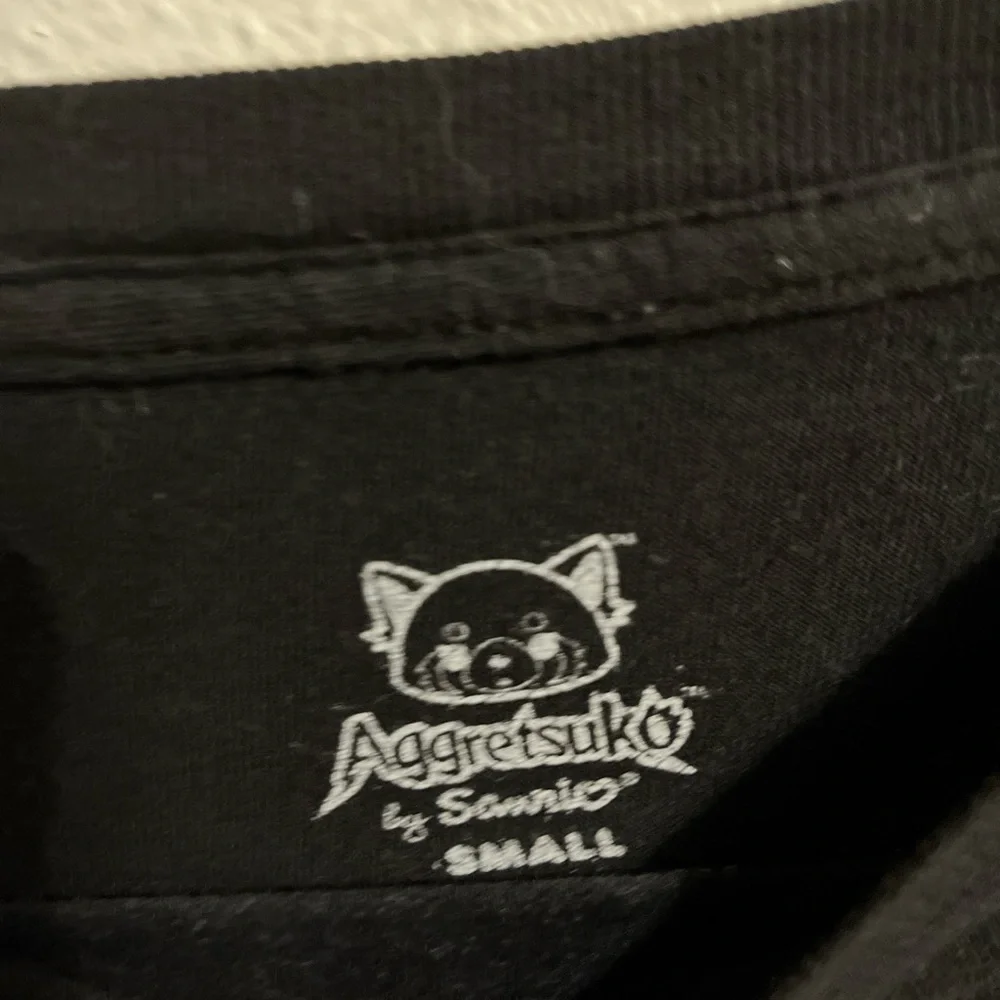 Black Graphic aggretsuko Sanrio T-Shirt - Short Sleeve